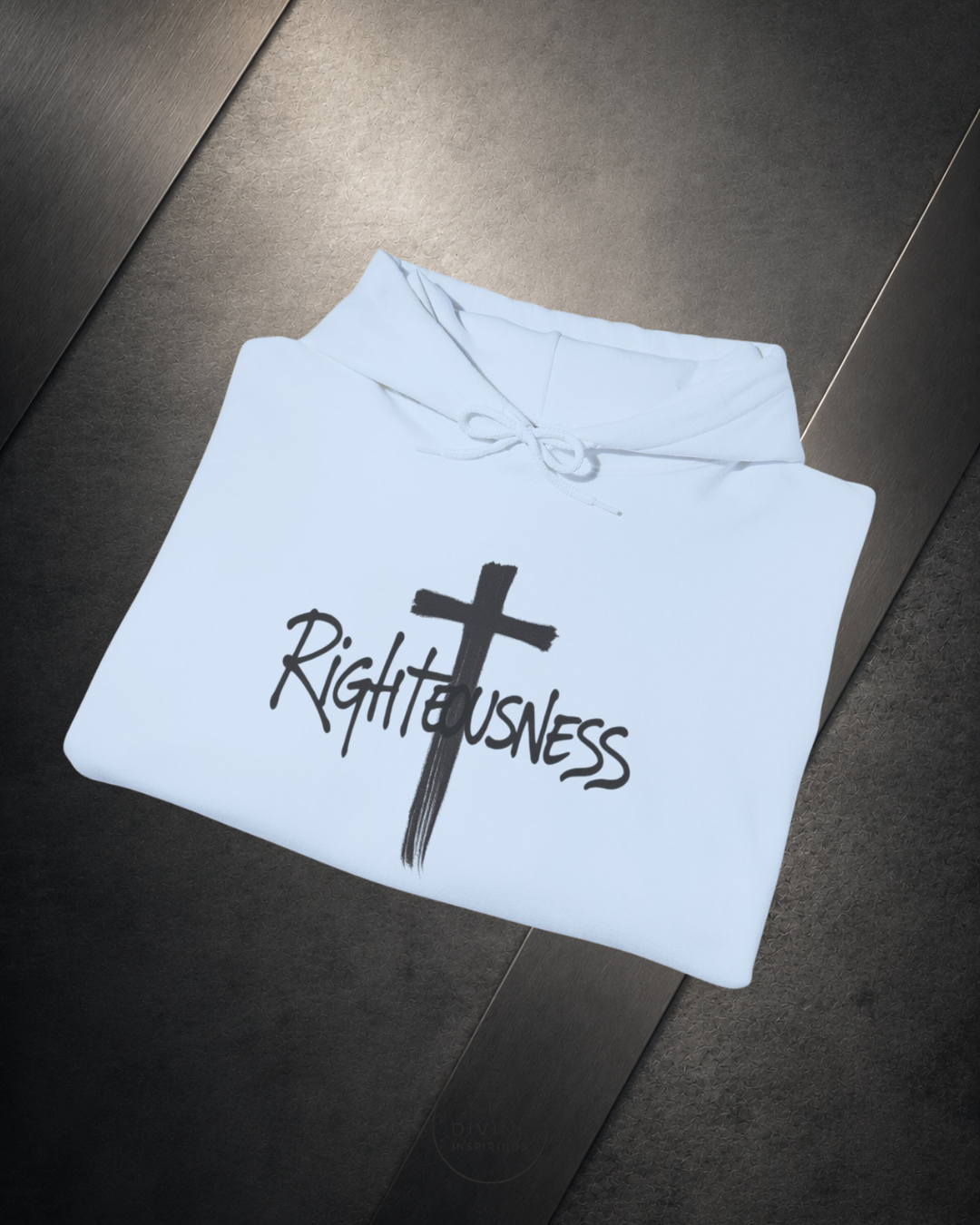 White hoodie with a cross and 'Righteousness' text on a dark surface