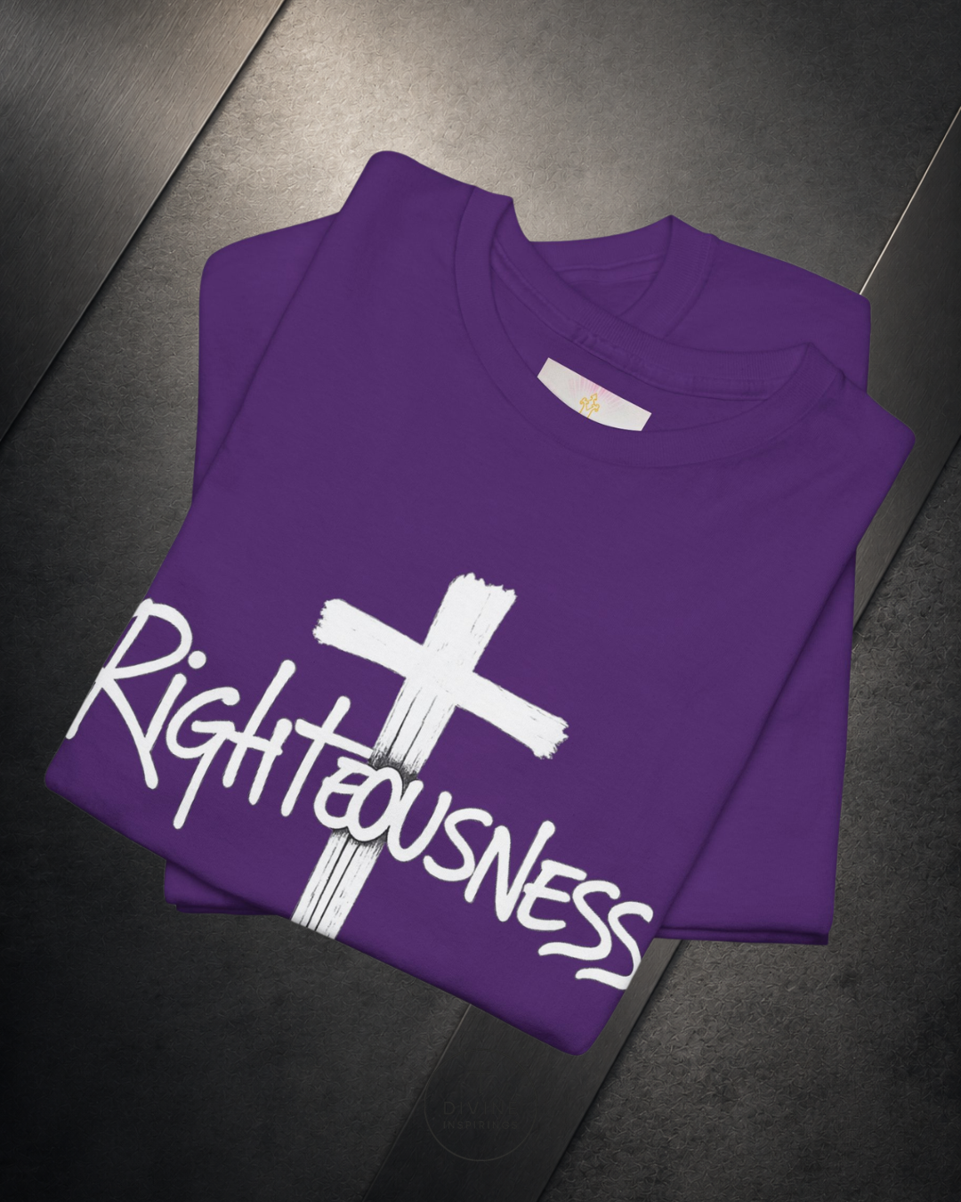 Purple shirt with a white cross and 'Righteousness' text on a dark surface