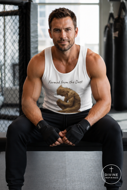 A muscular man in a gym setting wearing a white tank top with a graphic of a praying Buddha and the text 'Formed From The Dust'. He is wearing black workout pants and fingerless gloves, sitting on a bench.