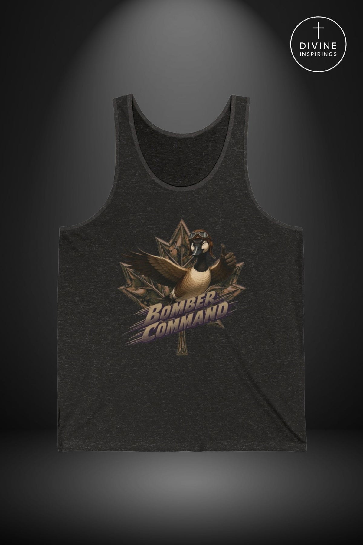 A dark charcoal gray heathered tank top featuring a graphic of a fighter jet and a maple leaf with the text 'Bomber Command' in a stylized font. The tank top is displayed against a dark gray background with a spotlight effect, and a 'Divine Inspirings' logo is visible in the top right corner.