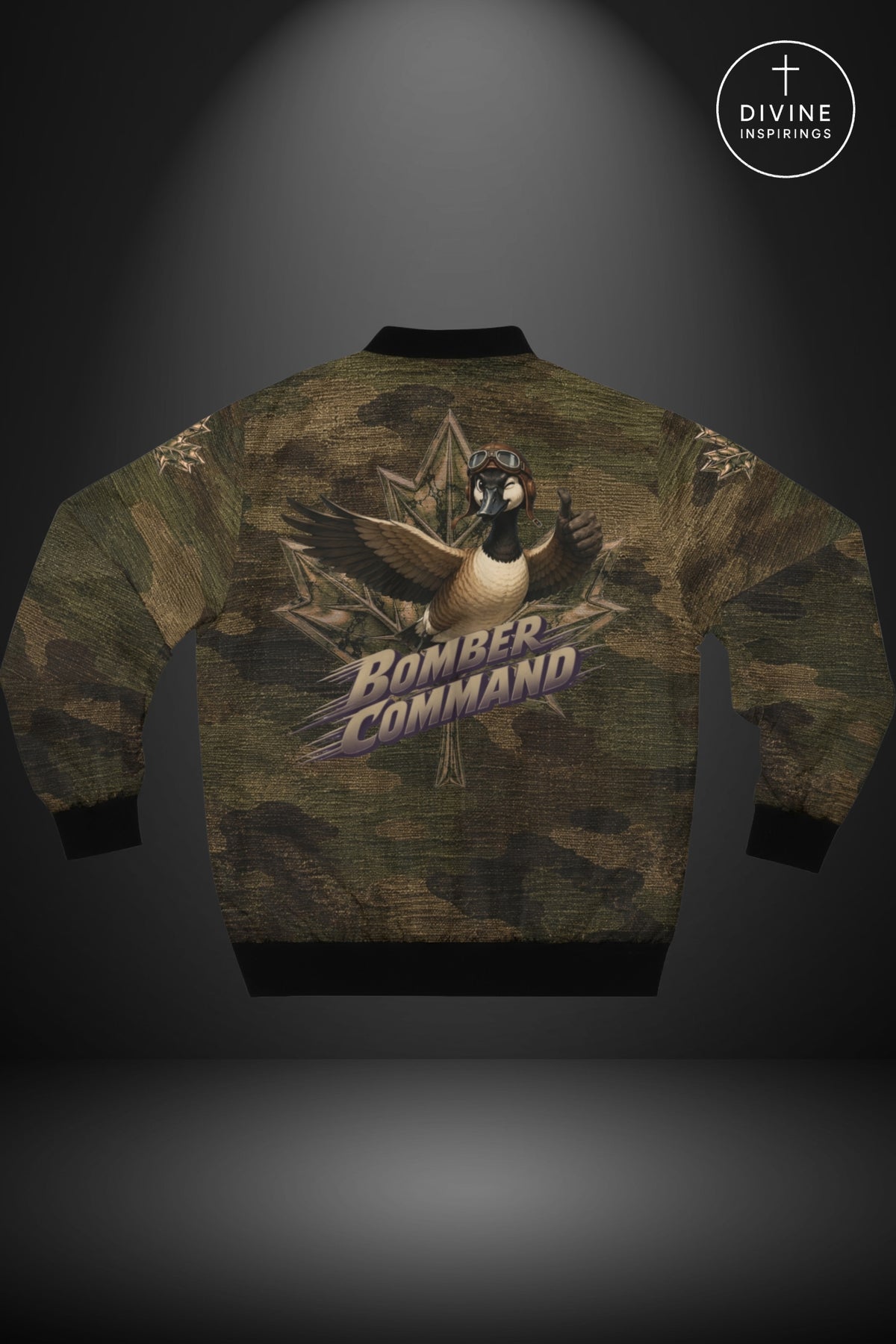 Back view of a bomber jacket featuring a green and brown camouflage pattern with a central graphic of a bird wearing a headset and the words 'BOMBER COMMAND' in stylized text. The jacket has black ribbed cuffs, hem, and collar, and is displayed against a dark gray background with a spotlight effect.