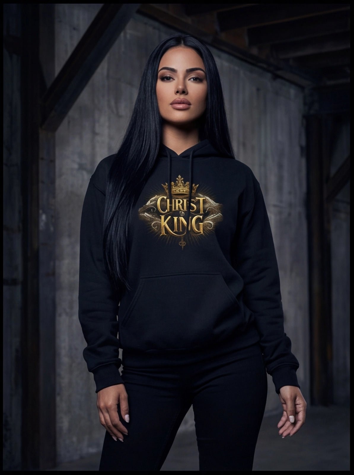 Person wearing a black hoodie with 'Christ King' text in gold.