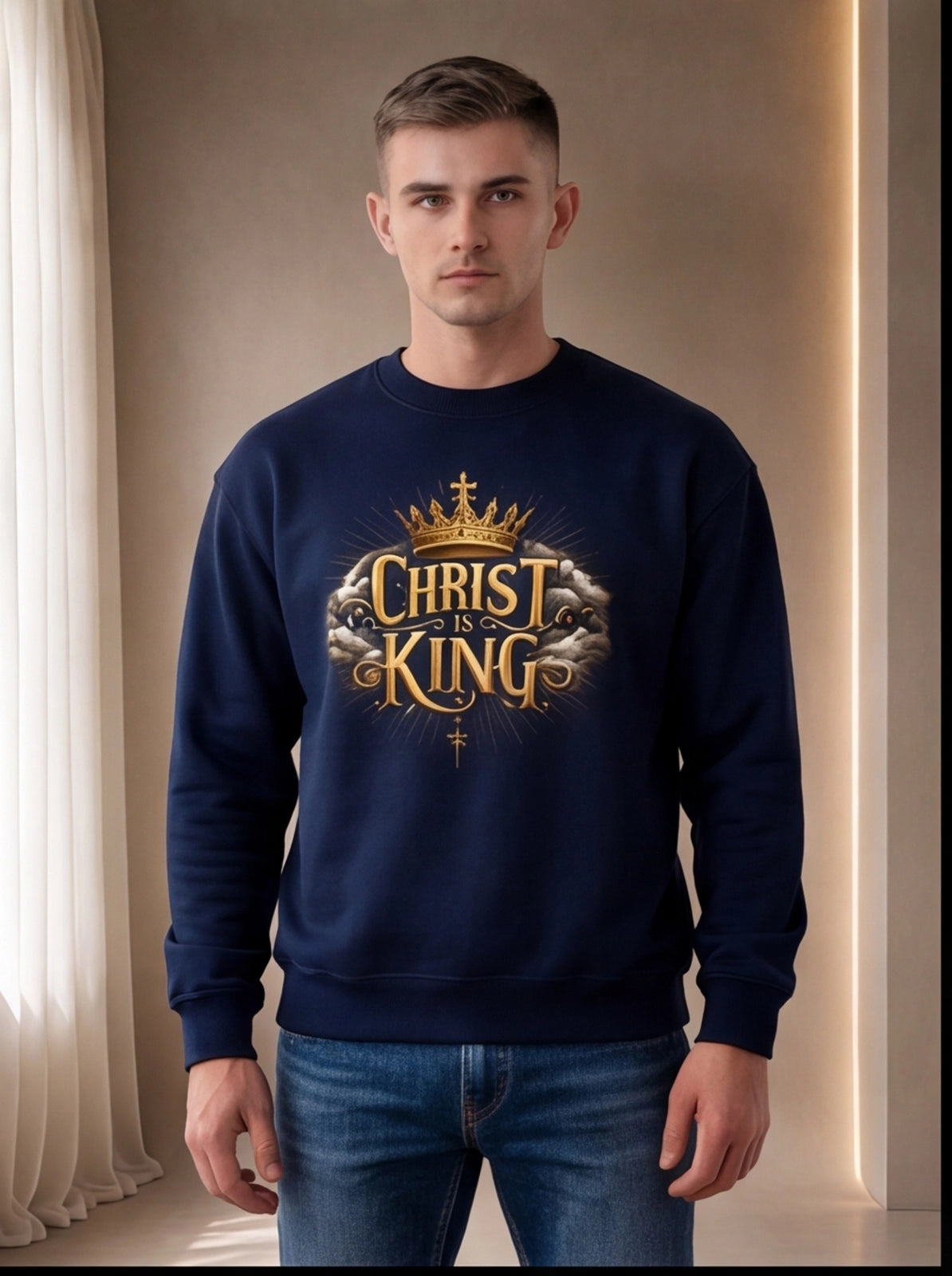 Man wearing a navy blue sweatshirt with 'Christ is King' design in gold and white.