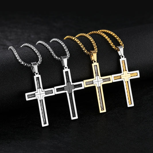 Four cross-shaped pendants on chains against a dark background