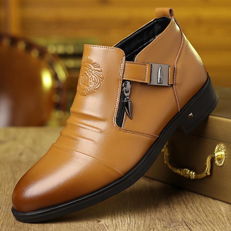 Brown leather boot with a buckle on a wooden surface