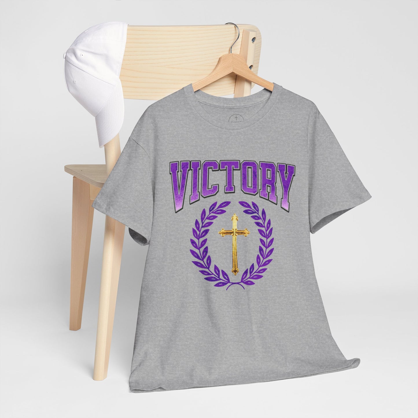 Gray t-shirt with 'VICTORY' and cross design on a wooden hanger against a white background