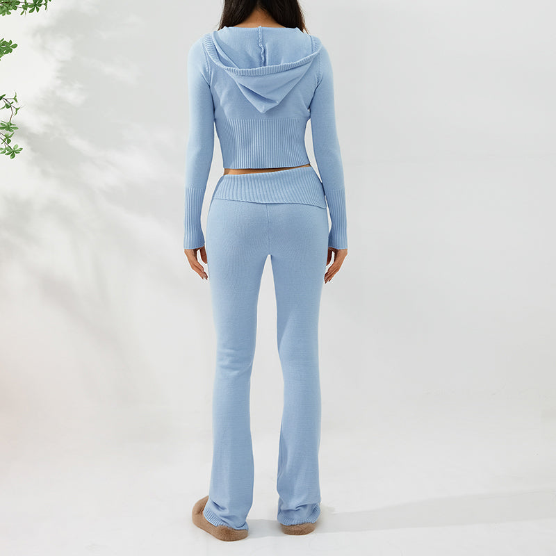 Light blue long-sleeve top and flared pants set on a white background