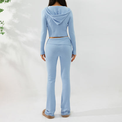 Light blue long-sleeve top and flared pants set on a white background