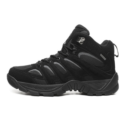 Black hiking boot with gray accents on a white background