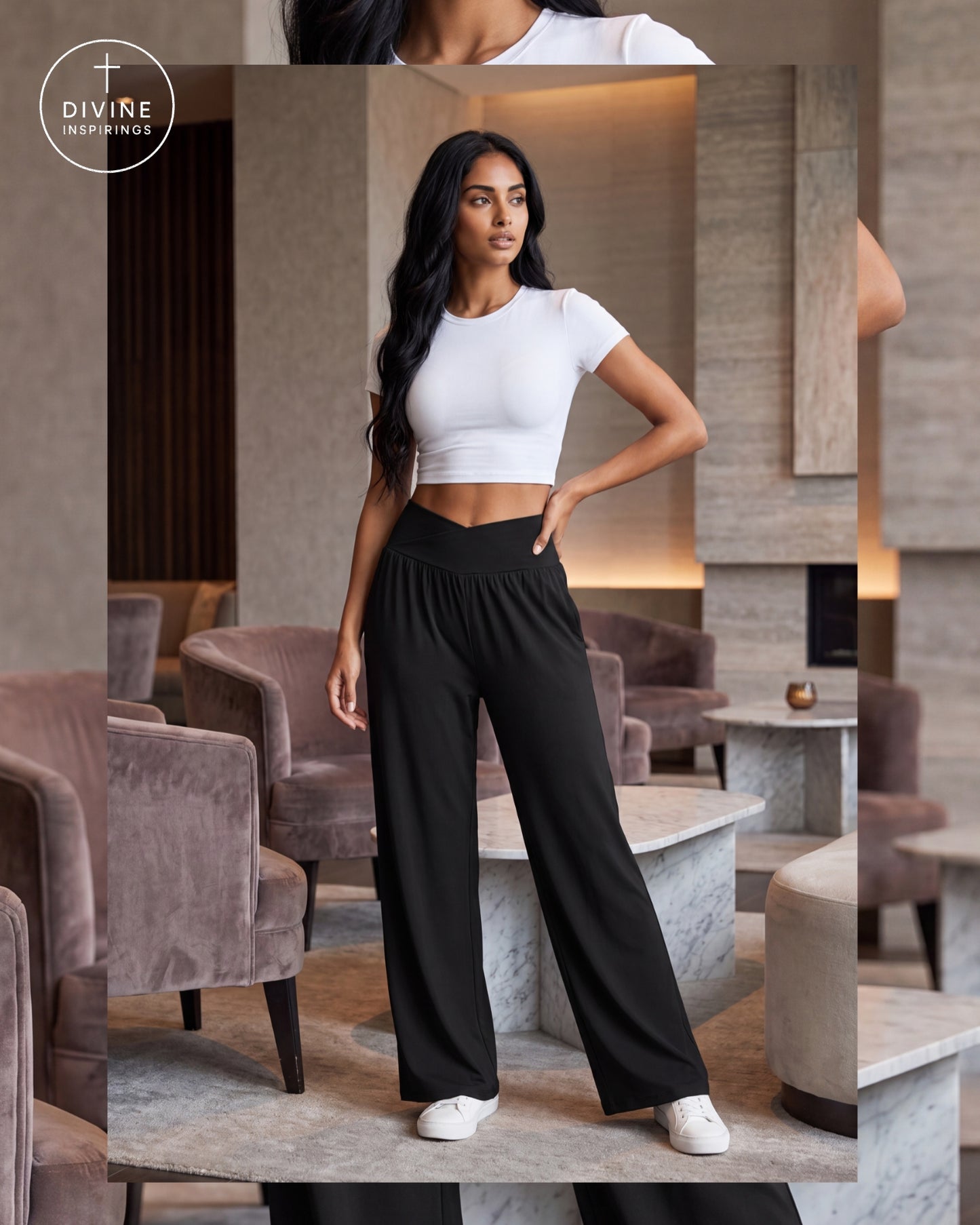A woman modeling a white short-sleeve crop top and black wide-leg pants in a modern indoor lounge setting. The image includes a circular 'Divine Inspirings' logo in the upper left corner.
