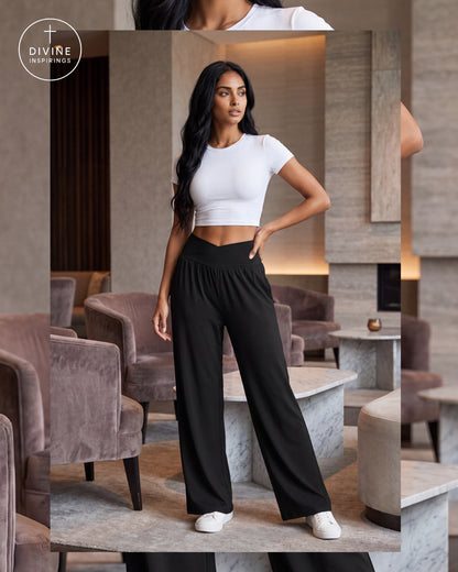 A woman modeling a white short-sleeve crop top and black wide-leg pants in a modern indoor lounge setting. The image includes a circular 'Divine Inspirings' logo in the upper left corner.