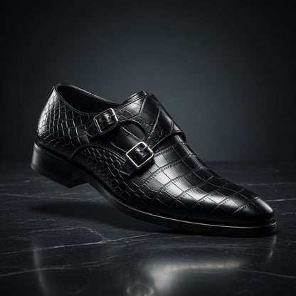 Black leather dress shoe with double buckle on a dark surface