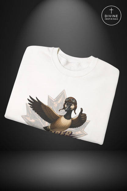 A folded white crewneck sweatshirt featuring a graphic of a geese with wings spread, set against a dark gray background with a spotlight effect and a 'Divine Inspirings' logo in the top right corner.