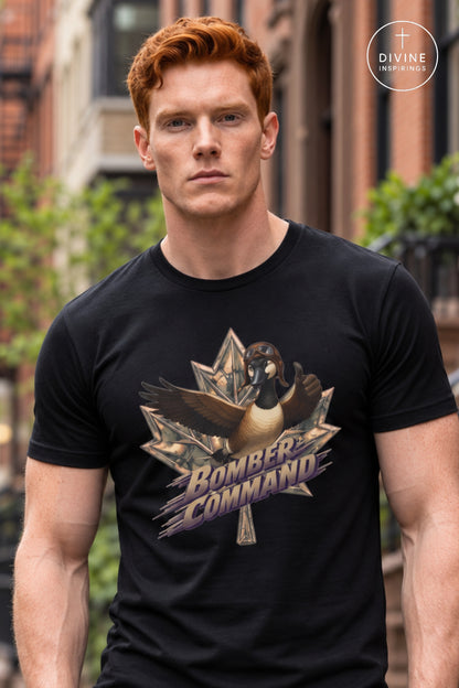 A man wearing a black t-shirt with a graphic of a goose inside a star and the text 'BOMBER COMMAND' in purple and gold. The background is a blurred outdoor street scene, and a 'DIVINE Divine Inspirings ' logo is visible in the top right corner.