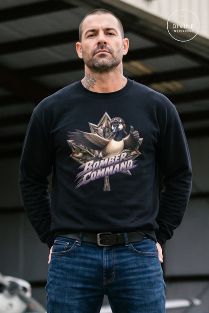 A man wearing a black long-sleeve crewneck sweatshirt with a graphic of a goose and the text 'Bomber Command' in purple and white, paired with blue jeans.