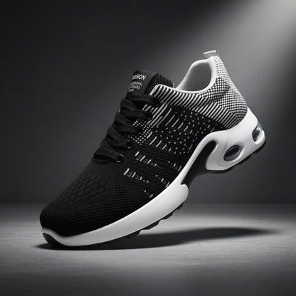 Black and white athletic shoe on a dark background