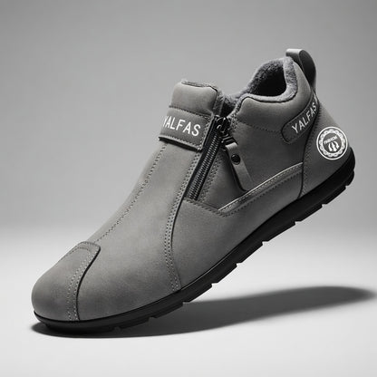 Gray shoe with brand logo on a gray background