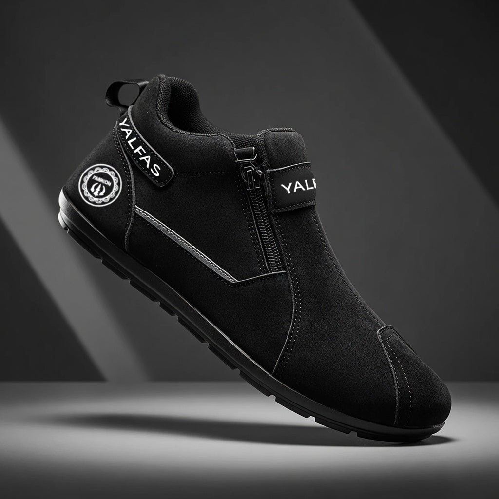 Black ankle boot with visible branding on a dark background