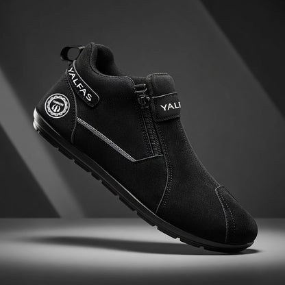 Black ankle boot with visible branding on a dark background