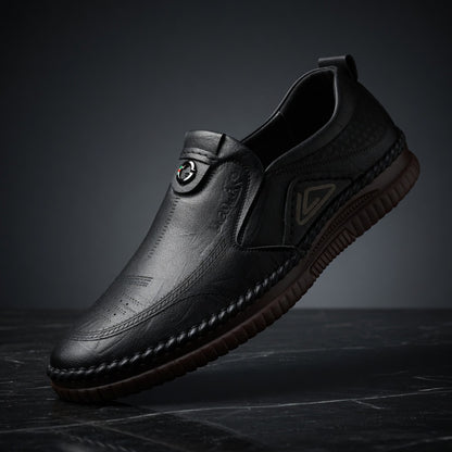 Black leather shoe on a dark background