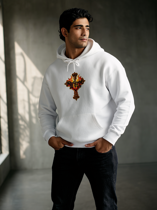 Man wearing a white hoodie with a logo in a room with a window casting shadows.