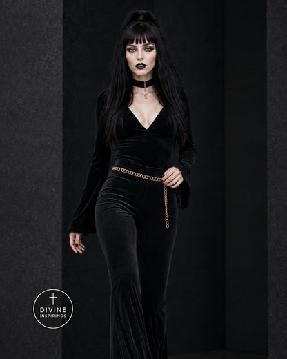 A gothic-style model with long black hair and a high ponytail wears a black velvet outfit and a gold chain belt. She is posed against a dark textured studio backdrop with a 'DIVINE INSPIRINGS' logo in the bottom-left corner.