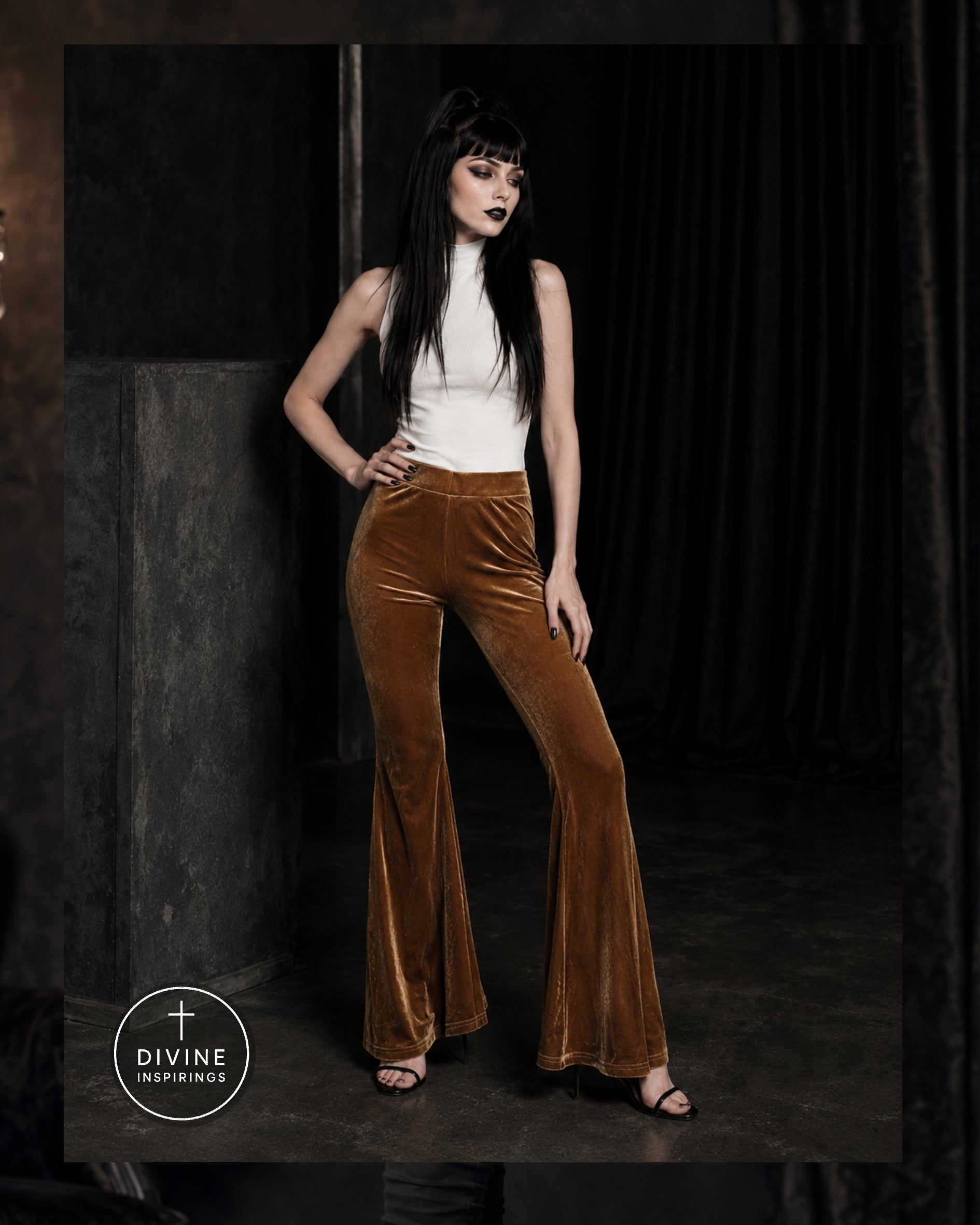 A model wearing high-waisted, wide-leg brown velvet flare pants with a white sleeveless top, posing in a dark, moody studio setting. A circular 'DIVINE INSPIRINGS' logo is visible in the bottom-left corner.
