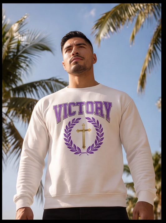 Man wearing a white sweatshirt with 'VICTORY' printed on it against a palm tree background