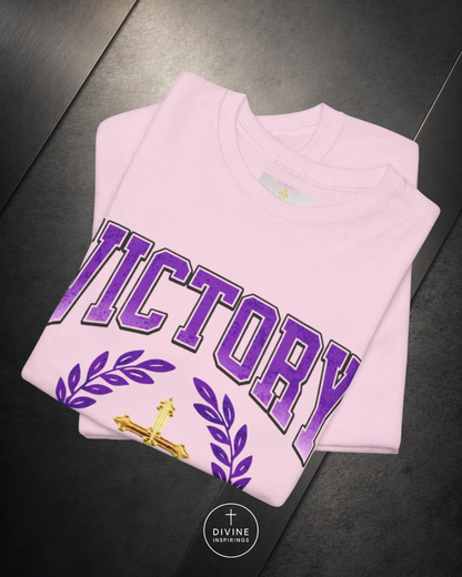 Pink sweatshirt with 'VICTORY' printed in purple on a dark surface