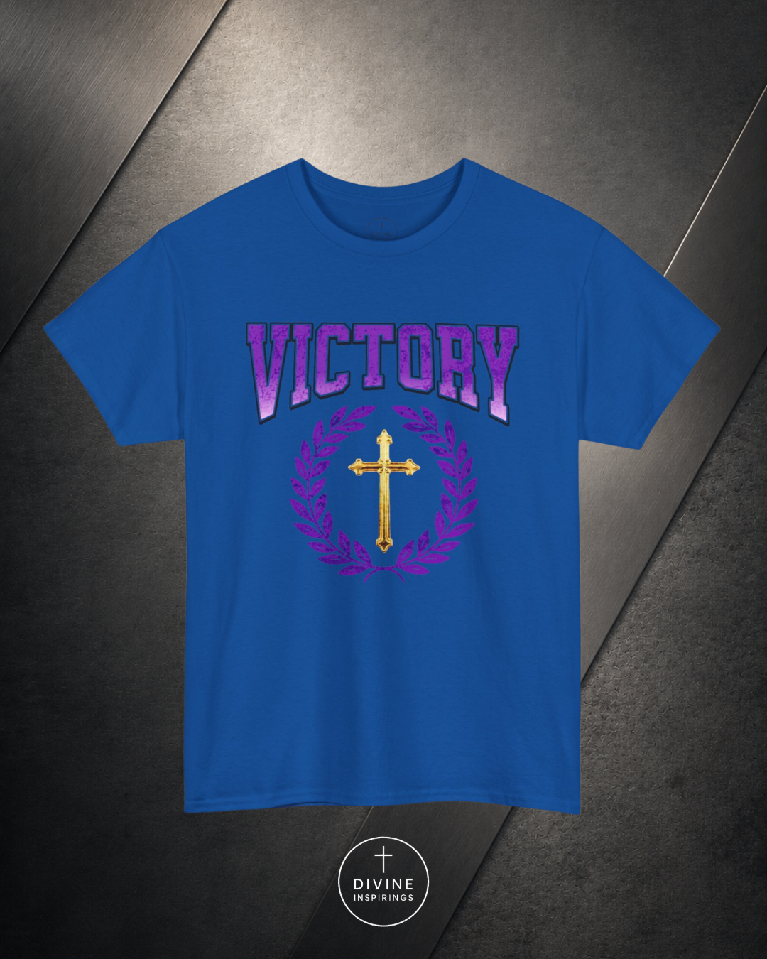 Blue t-shirt with 'VICTORY' text and cross design on a dark background