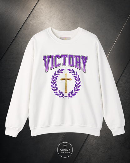 White sweatshirt with 'Victory' and cross design on a dark background