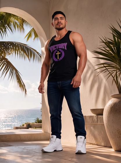 Man wearing a black tank top with 'Victory' and 'Purple' text, standing in a tropical setting.