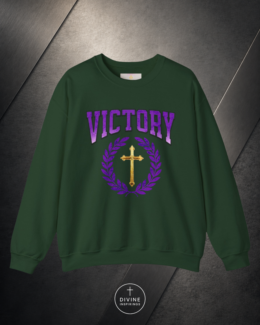 Green sweatshirt with 'VICTORY' and cross design on a dark background