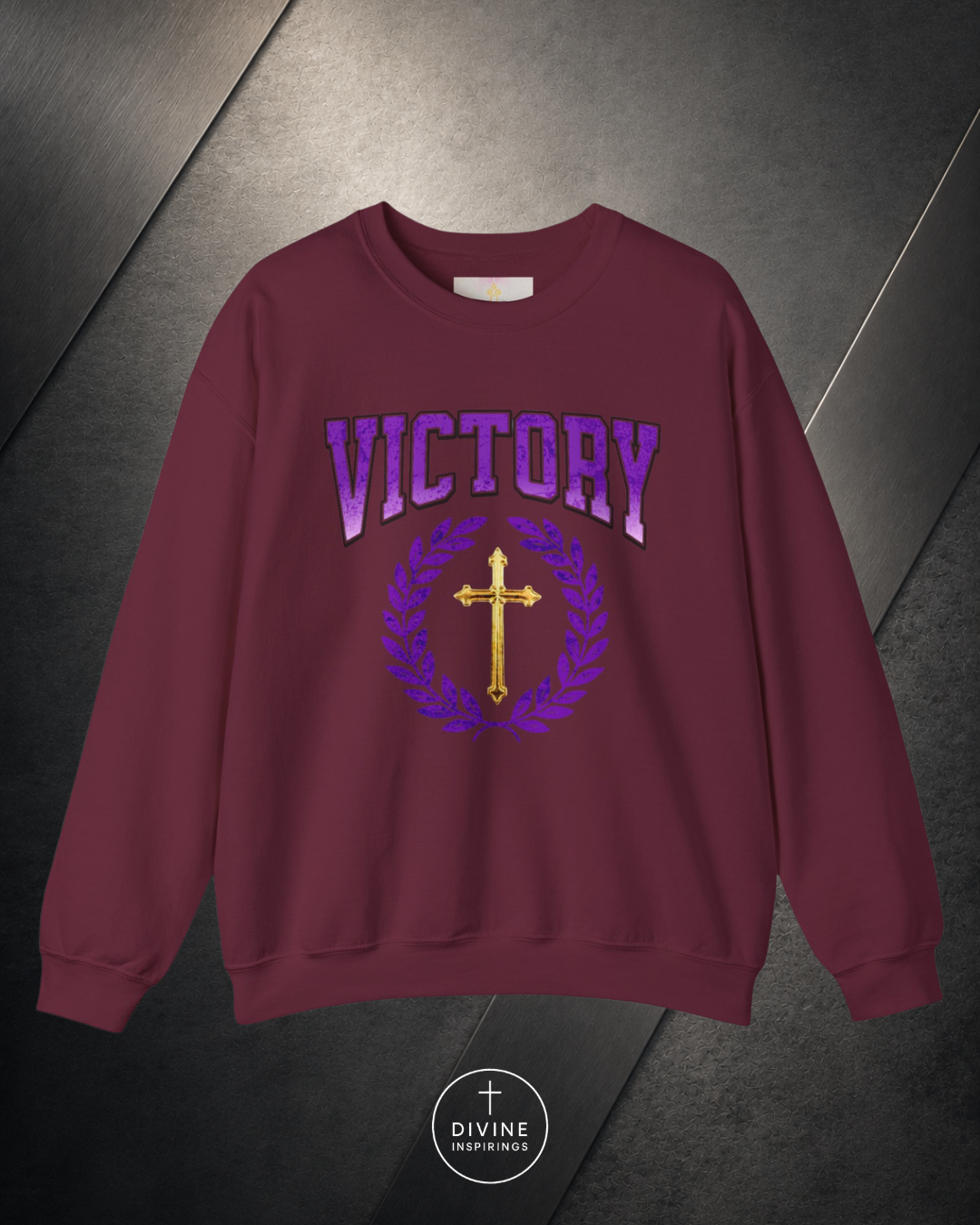 Maroon sweatshirt with 'VICTORY' and cross design on a dark background