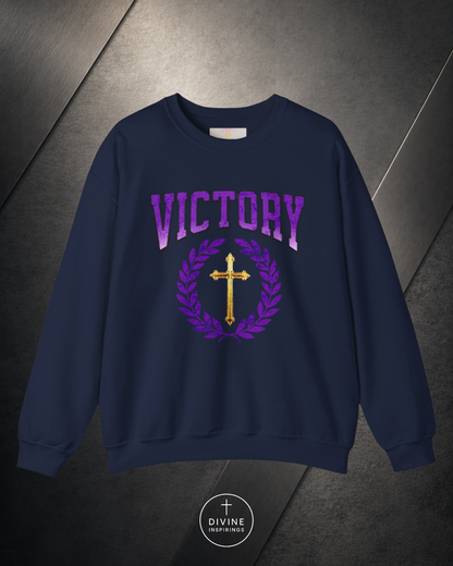 Navy blue sweatshirt with 'VICTORY' and cross design on a dark background