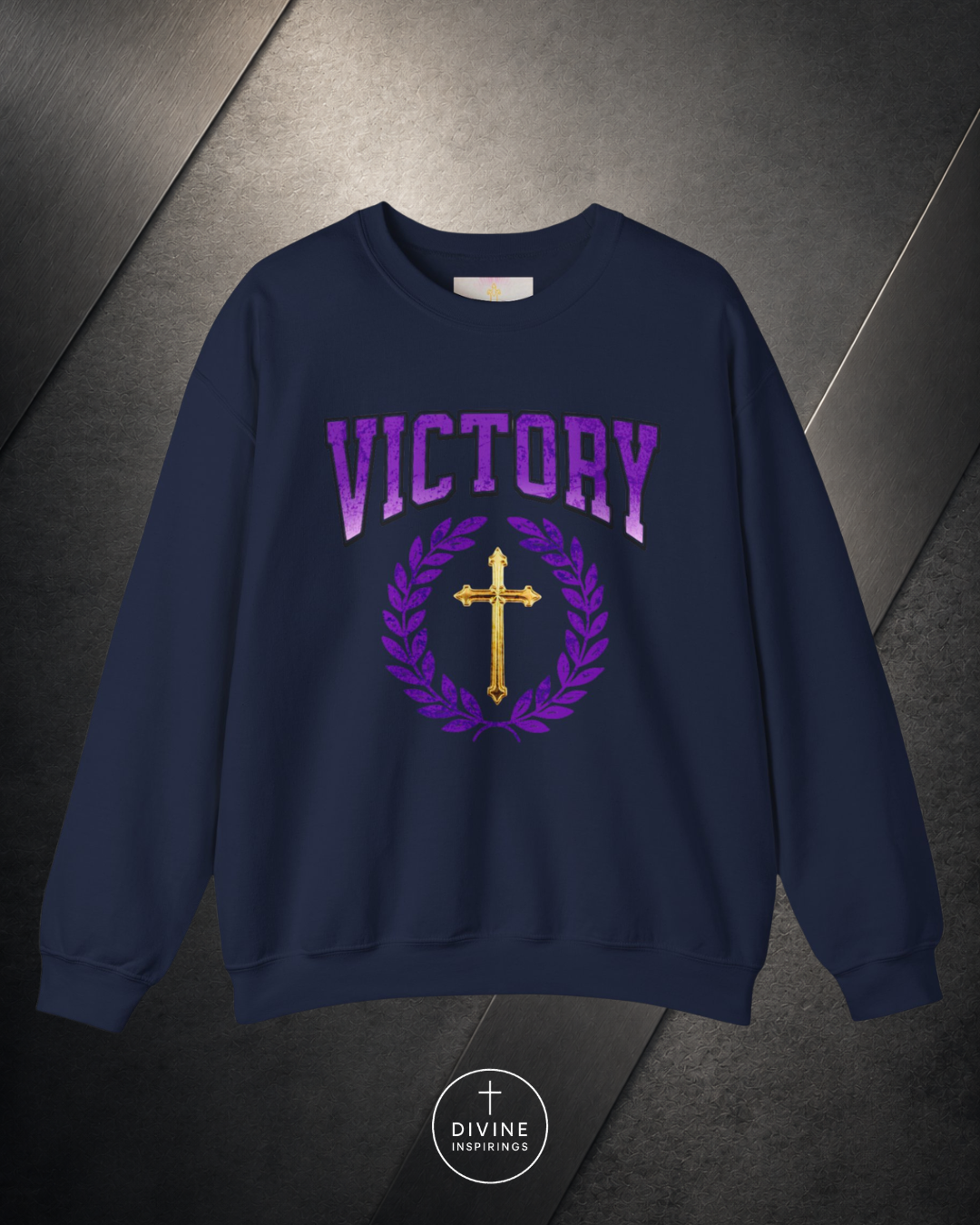 Navy blue sweatshirt with 'VICTORY' and cross design on a dark background