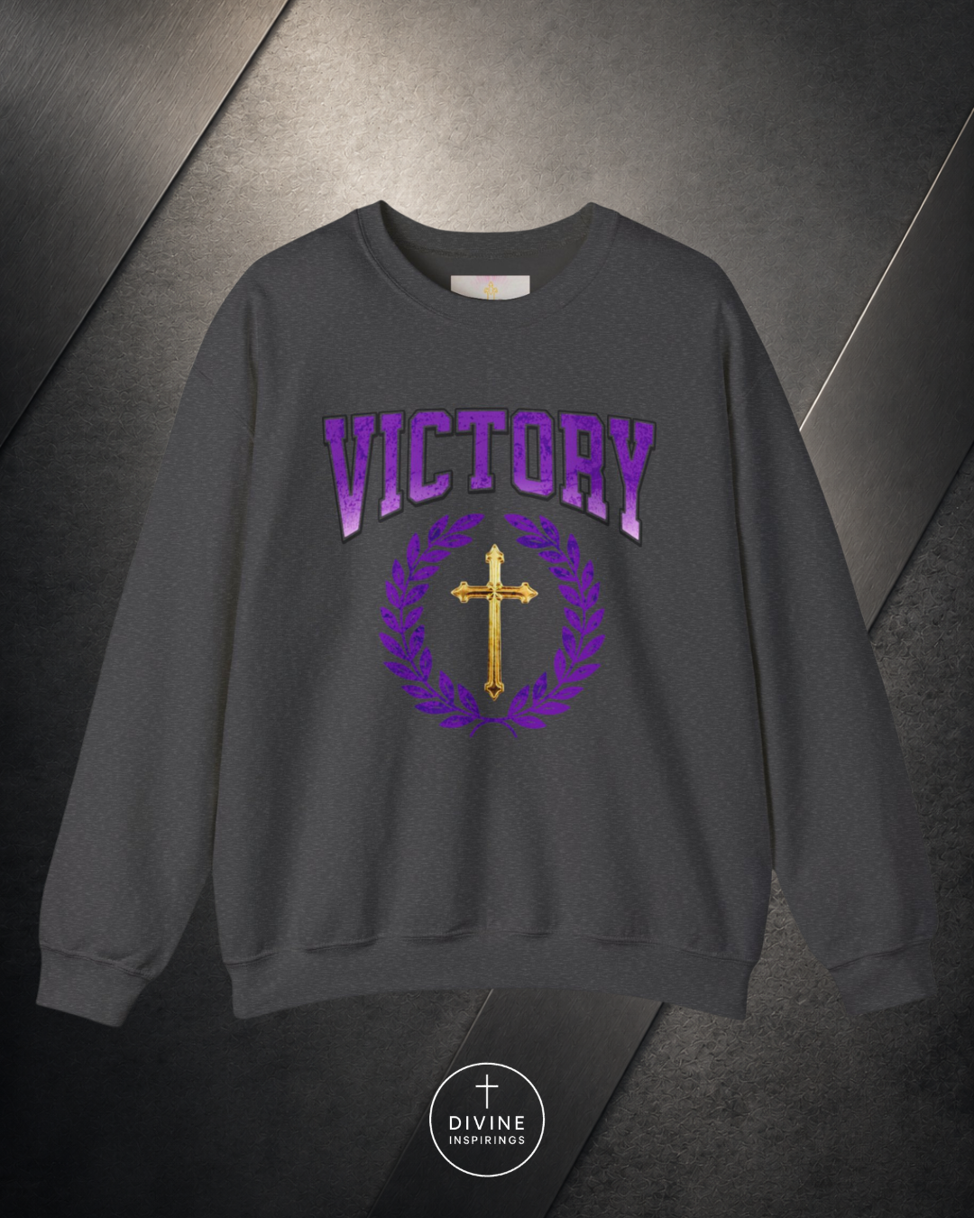 Gray sweatshirt with 'VICTORY' and cross design on a dark background