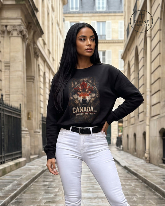 A woman stands in a narrow city street wearing a black crewneck sweatshirt with a large wolf graphic and the text 'CANADA.