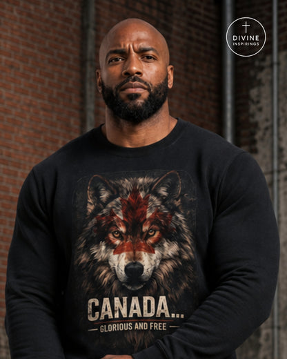 A muscular man with a shaved head and beard wearing a black long-sleeve crewneck sweatshirt with a graphic of a wolf with red paint on its forehead and the text 'CANADA.