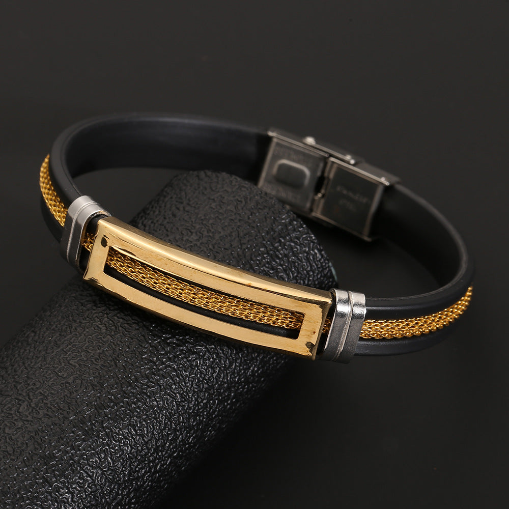 Black and gold bracelet on a dark background