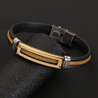 Black and gold bracelet on a dark background