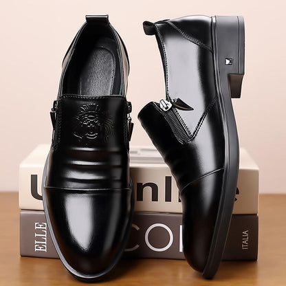 Pair of black dress shoes on a beige background