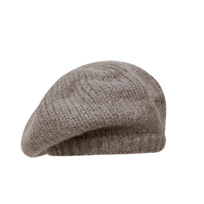 Brown knit beret on a white background