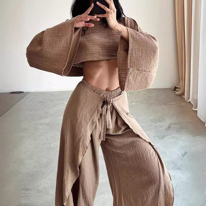 Person wearing a brown outfit in a minimal indoor setting